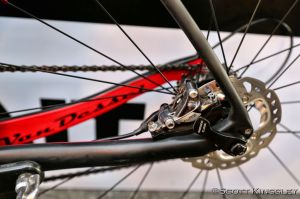 The rear disc brakes tuck into the rear triangle. To convert the frame to rim brakes, just take out the brake and mount.  Photo by ScottKingsleyPhotography.com.